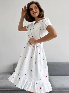 White mini dress with red heart prints, ruffled collar and button front detail