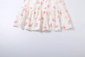 Detail of floral ruffle hemline on a strapless slim-fit A-line party dress