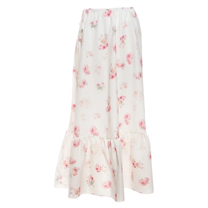 Detail of pink floral dress featuring an elastic waist and tiered ruffle hemline