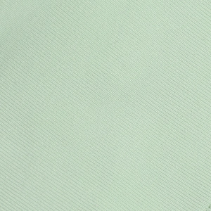 Macro detail of high-quality mint green twill fabric showing fine texture and weave