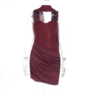 Detailed view of burgundy strapless dress featuring shimmery knit fabric and silk draping