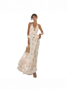 Women's floral halter top and tiered maxi skirt set with straw bag accessory