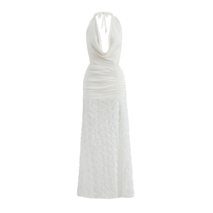 Detail of white halter dress featuring a 3D rose textured skirt and gathered waist