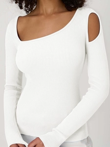 Close-up of white ribbed knit fabric with asymmetric cold shoulder and cutout design