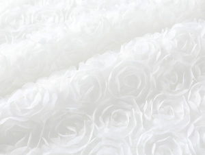 Detailed view of the 3D rose textured fabric on white backless slim fit dress
