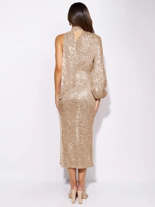 Detail of shimmering gold sequins on a sexy one-shoulder evening dress with side slit