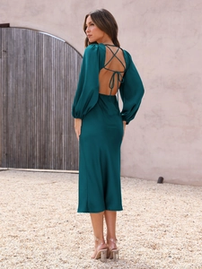 Detail of dark green satin dress with elegant cross-back lace-up and open back design