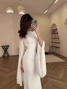 Elegant white slim fit maxi dress with unique cape split long sleeves for evening galas