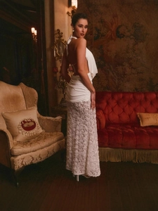 White halter backless dress featuring 3D floral rose textures in a vintage interior