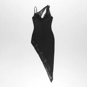 Detailed view of black one-shoulder dress with lace trim and asymmetrical hemline