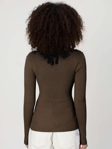 Detail of dark brown ribbed knit top with elegant black lace trim on the collar and back
