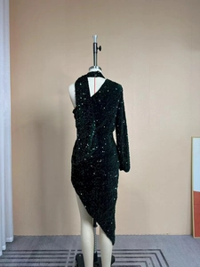 Detailed back view of a black sequin dress featuring an open back and high neck design