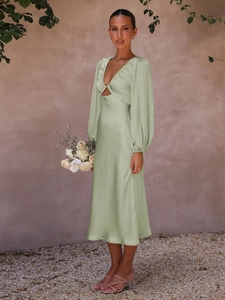 Sage green satin midi dress with long sleeves featuring a twist detail and cut-out waist