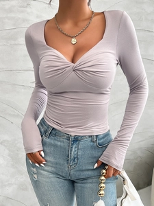 Detail of lavender twist-knot front top showing slim fit long sleeve design