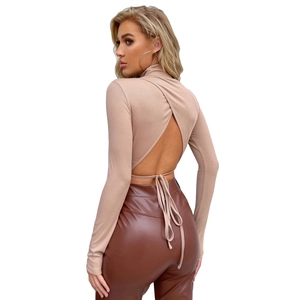 Detail of sexy backless beige long sleeve top with tie-up back and high neck knit fabric