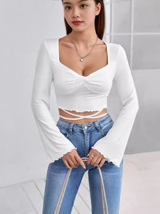 Elegant white square neck crop top with flared sleeves and stylish waist ties