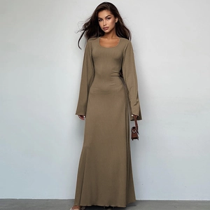 Detail of ribbed knit texture on a long sleeve brown maxi dress with side bag accessory