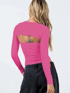 Close-up of pink long sleeve cutout top with backless design and elastic fabric