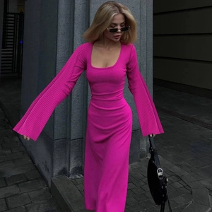 Detail of rose red ribbed knit dress featuring elegant flare sleeves and square neck