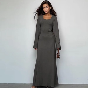 Detailed view of dark grey ribbed knit maxi dress featuring long sleeves and slim fit