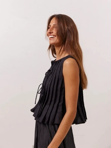 Elegant sleeveless pleated linen top for women with bow tie detail and modern loose fit