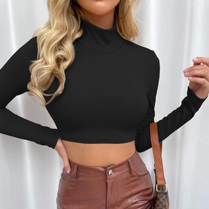 Close-up of black turtleneck ribbed crop top featuring long sleeves and slim fit texture