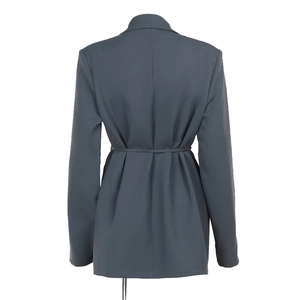 Detailed back view of a dark grey blazer featuring elegant waist drawstrings and pleated folds