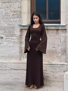 Deep brown ribbed knit dress with elegant flare sleeves and a slim maxi silhouette
