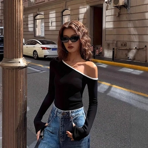 Chic off-shoulder long sleeve top with black and white contrast trim and slim fit design