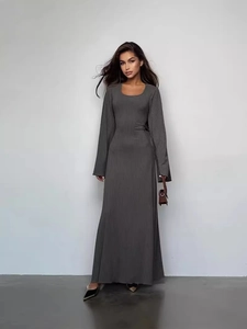 Deep grey long sleeve ribbed knit maxi dress with a fitted waist and elegant drape