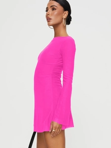 Detail of hot pink bodycon dress featuring elegant flared sleeves and slim fit fabric