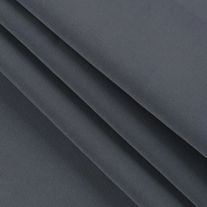 Macro detail of dark grey twill fabric showing fine texture of the long sleeve blazer