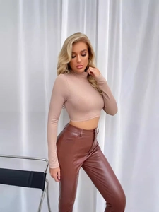 Slim fit beige high neck long sleeve top with brown faux leather straight pants