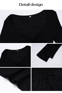 Detail view of black V-neck knitted top showing twist design and size S neck label