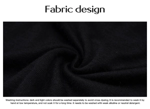 Detail showing soft black knit fabric texture and washing instructions for long sleeve top