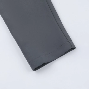 Detailed macro view of high-quality dark grey fabric texture and precise hem stitching