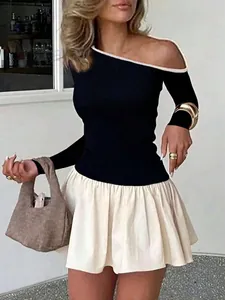 Chic black one-shoulder long sleeve top with beige pleated mini skirt and tote bag