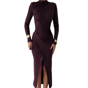 Detail of elegant plum high-neck maxi dress with ruching effects and high side slit