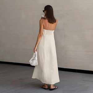 Detail of the smocked elastic back on a khaki cotton linen strapless A-line maxi dress