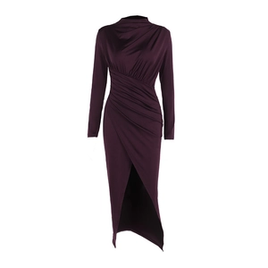 Detailed view of ruched waist and asymmetric high-slit hem on plum mock-neck dress