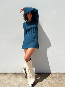 Detail of slim-fit navy blue long sleeve mini dress with a smooth elastic texture