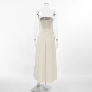 Detail of smocked back design and hidden zipper on khaki linen blend A-line dress