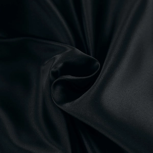 Close-up of silky black satin fabric with elegant drape and high-gloss finish details