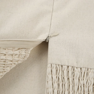 Detailed close-up of khaki cotton-linen dress fabric featuring invisible zipper and pleats