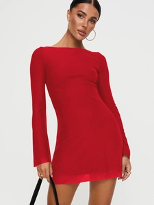 Detail of red off-shoulder mini dress featuring elegant ruffles and long sleeves