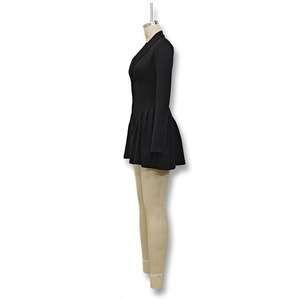 Side view of black long sleeve dress with deep V-neck and pleated skirt details