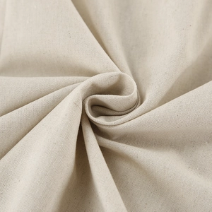 Macro detail of breathable beige cotton linen fabric texture for summer vacation dresses