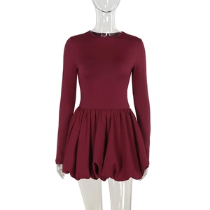 Detail of wine red bodycon mini dress with elegant bubble hem and long sleeves