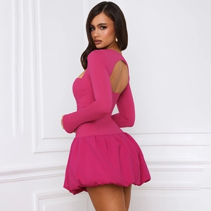 Detail view of hot pink mini dress with open back design and puffy bubble skirt
