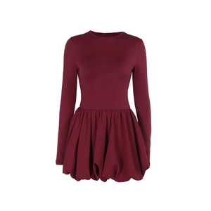 Detailed view of dark red slim-fit knit dress with voluminous bubble hem and long sleeves